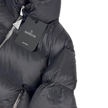 Moncler black nylon down puffer jacket with logo patch and quilted design.