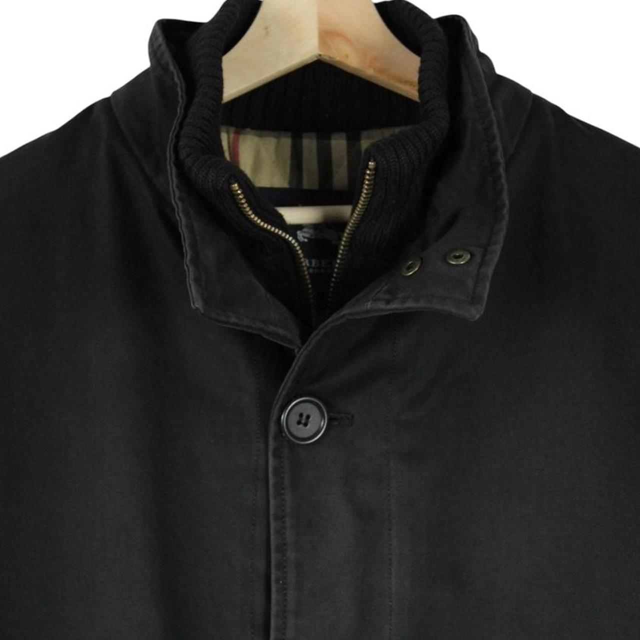 Burberry black coat with Nova Check lining and full zip closure, vintage style.