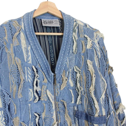 Coogi blue cotton knit full zip cardigan with signature colorful pattern and logo.
