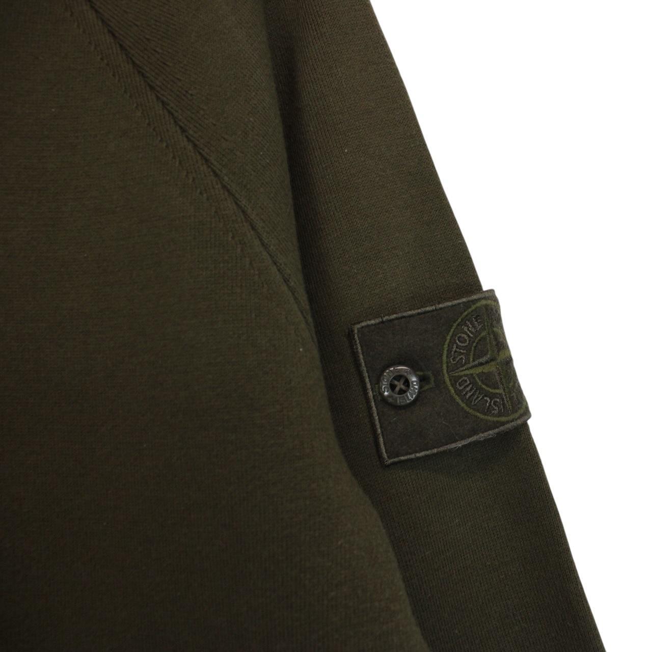 Stone Island khaki green sweatshirt with ghost logo and soft cotton material.