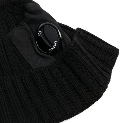 CP Company black beanie hat made of extra fine merino wool with side lens detail.