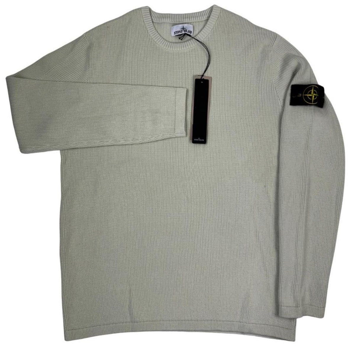 Stone Island beige waffle knit jumper with logo patch and organic cotton material.