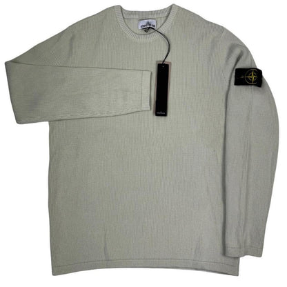 Stone Island beige waffle knit jumper with logo patch and organic cotton material.