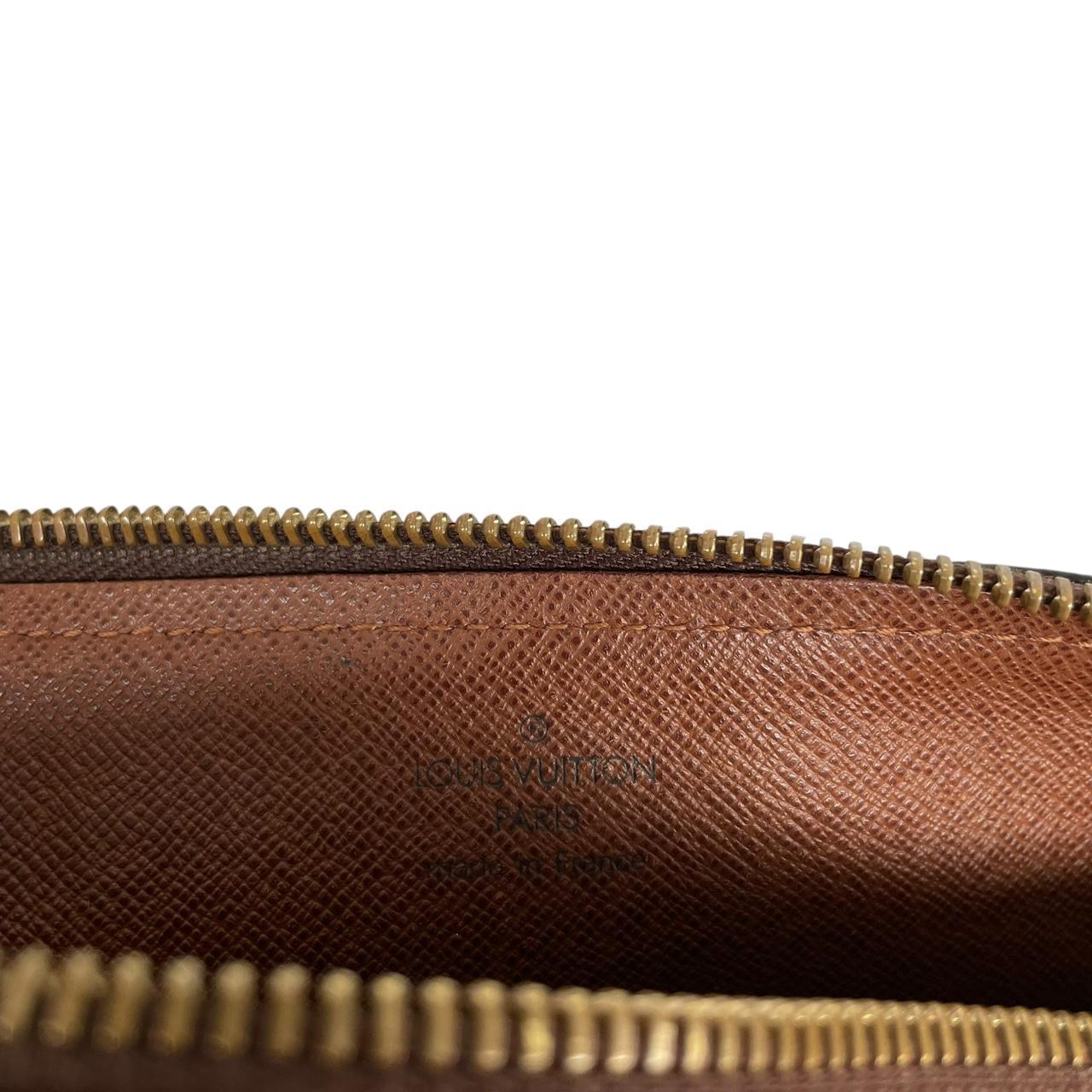 Louis Vuitton duffel bag brown and tan monogram canvas with logo and piping details.