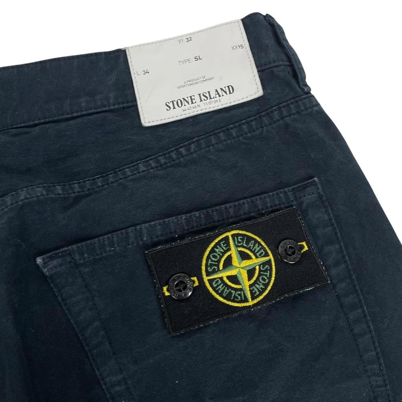 Stone Island navy blue slim fit cotton trousers with logo patch and side pockets.