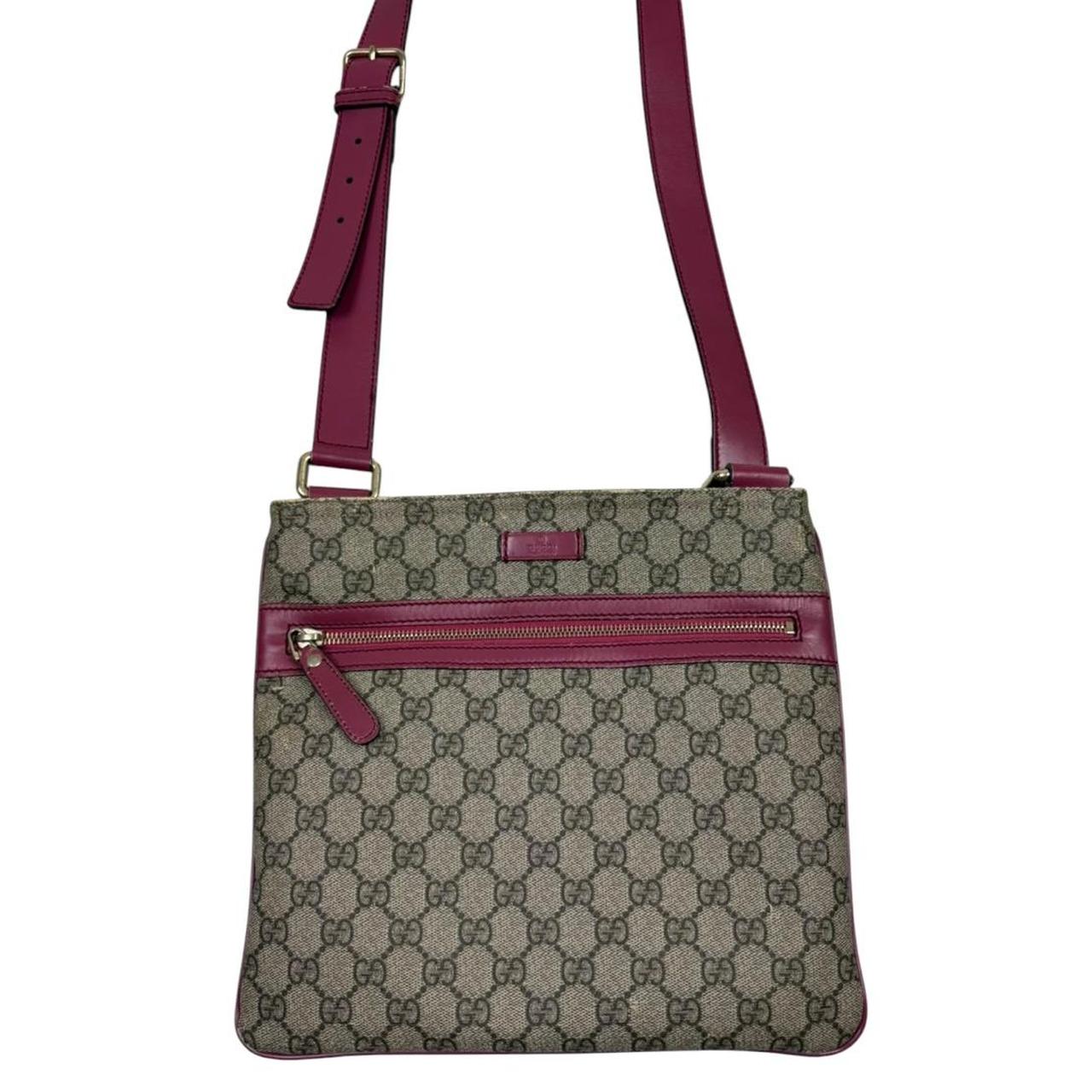 Gucci beige and pink duffel bag with GG Supreme monogram canvas pattern.