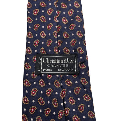 Christian Dior navy blue silk tie with paisley print pattern and logo detail.
