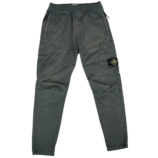 Stone Island grey cargo trousers with logo patch and pockets, visible discolouration.