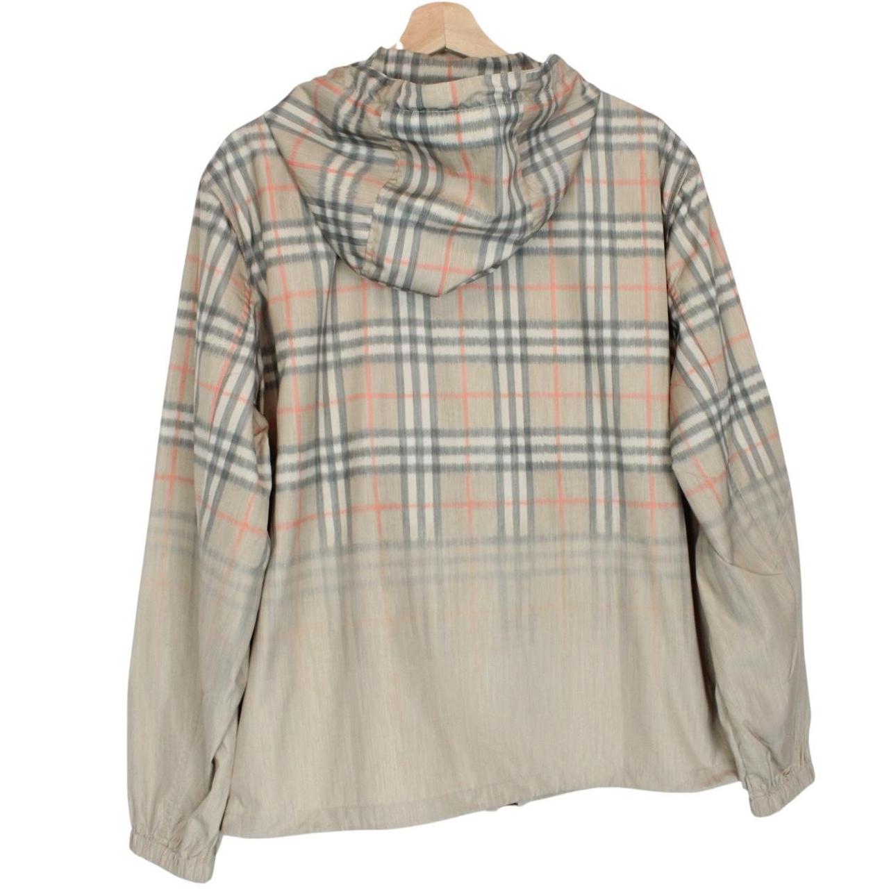 Burberry beige windbreaker jacket with Nova Check pattern and full zip hood.