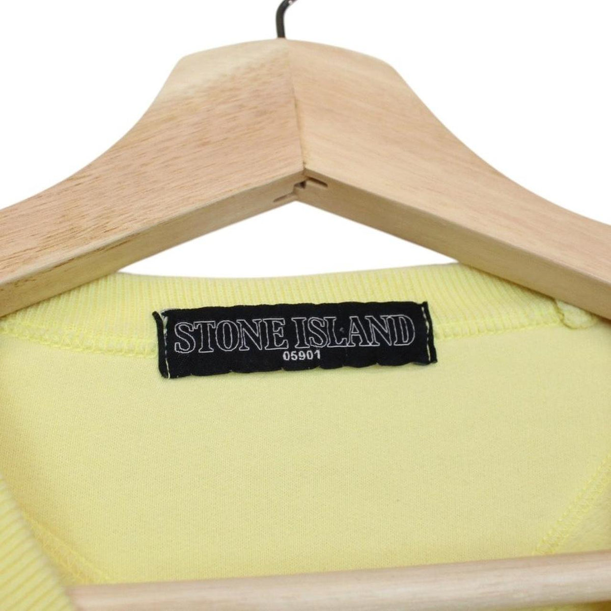 Stone Island yellow v-neck sweatshirt with logo patch and soft cotton material.