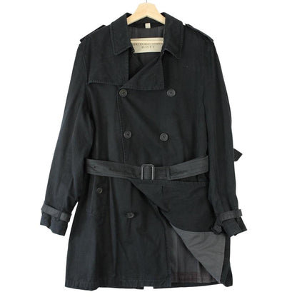 Burberry black trench coat with Nova Check pattern and double-breasted design.