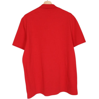 Lacoste red short sleeve polo shirt with embroidered crocodile logo, cotton material.