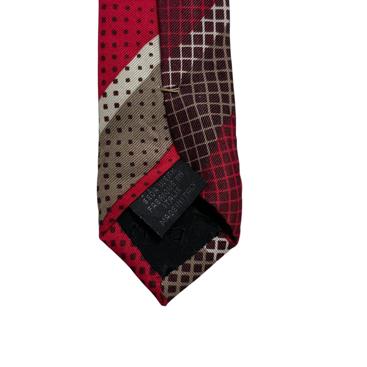 DKNY red silk tie with vintage stripes and logo detail.