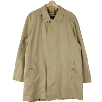 Burberry tan brown single breasted cotton overcoat with logo detail and classic design.