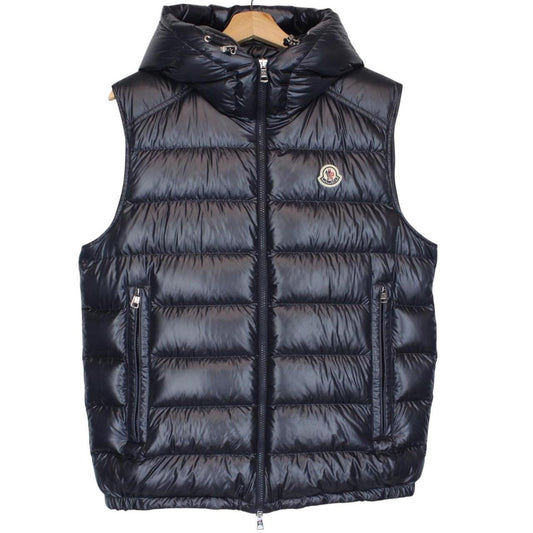 Moncler navy blue hooded nylon down gilet with logo and quilted texture.