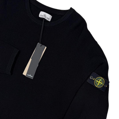 Stone Island black ribbed knit jumper with logo badge and organic cotton material.