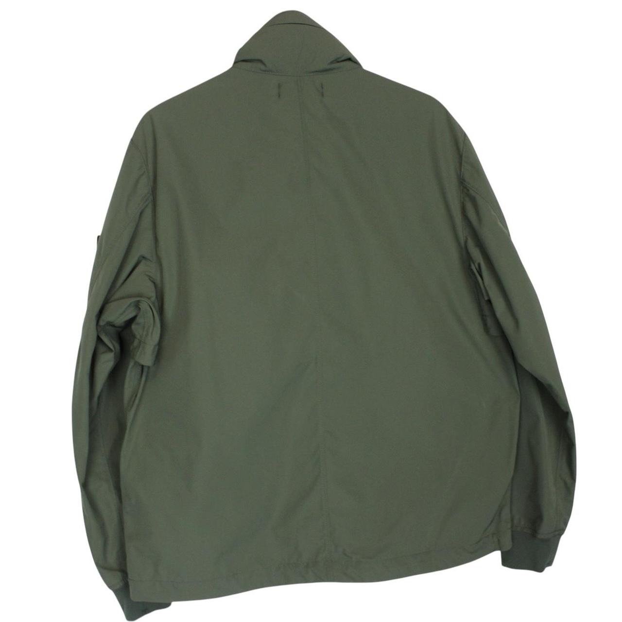 Stone Island green full zip jacket with packable hood and removable brand patch.