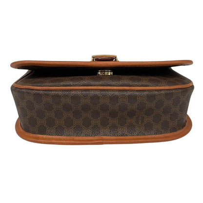 CELINE brown and tan duffel bag with Macadam pattern and leather/canvas material.