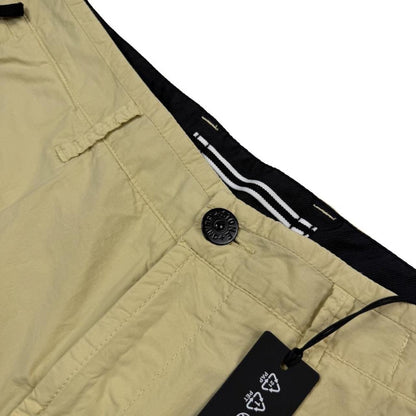 Stone Island beige cargo shorts with logo patch and multiple pockets in cotton material.