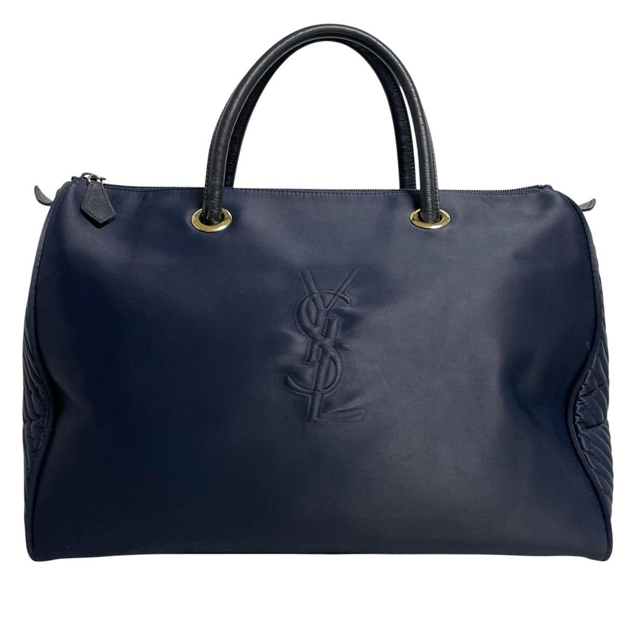 Yves Saint Laurent navy blue duffel bag embossed logo nylon material with handles.