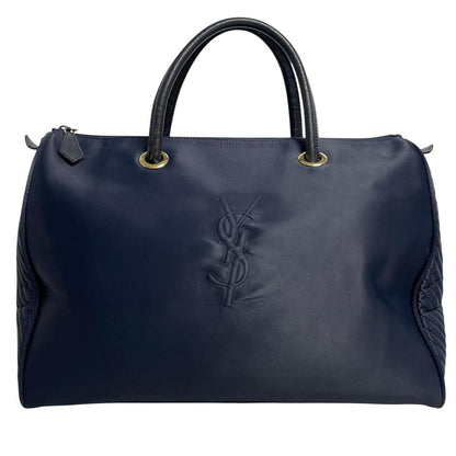 Yves Saint Laurent navy blue duffel bag embossed logo nylon material with handles.