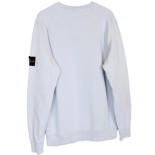 Stone Island blue cotton sweatshirt with logo patch and faded left sleeve.