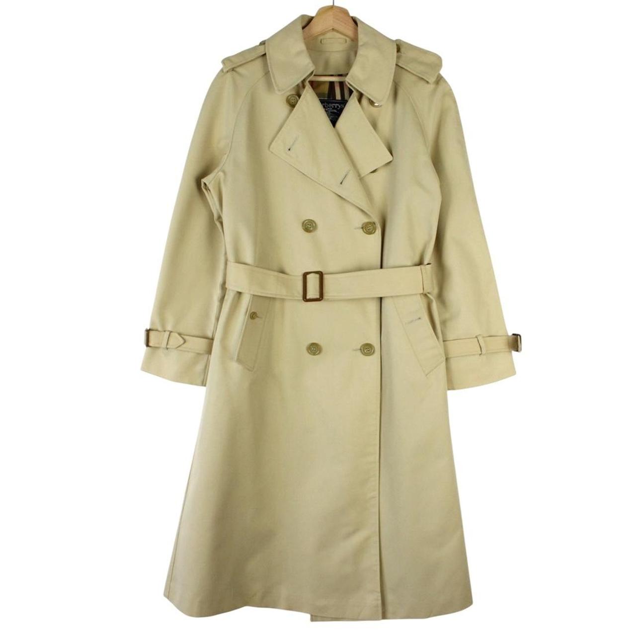 Burberry beige trench coat with Nova Check pattern, double-breasted and belted design.