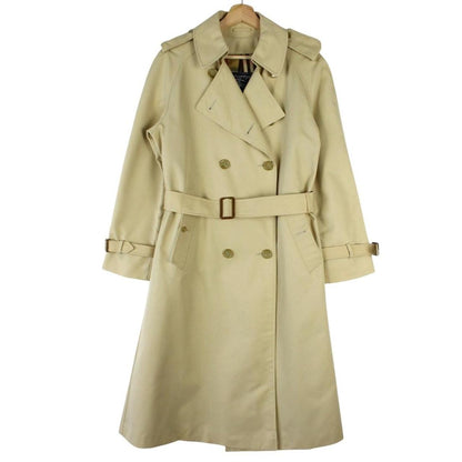 Burberry beige trench coat with Nova Check pattern, double-breasted and belted design.