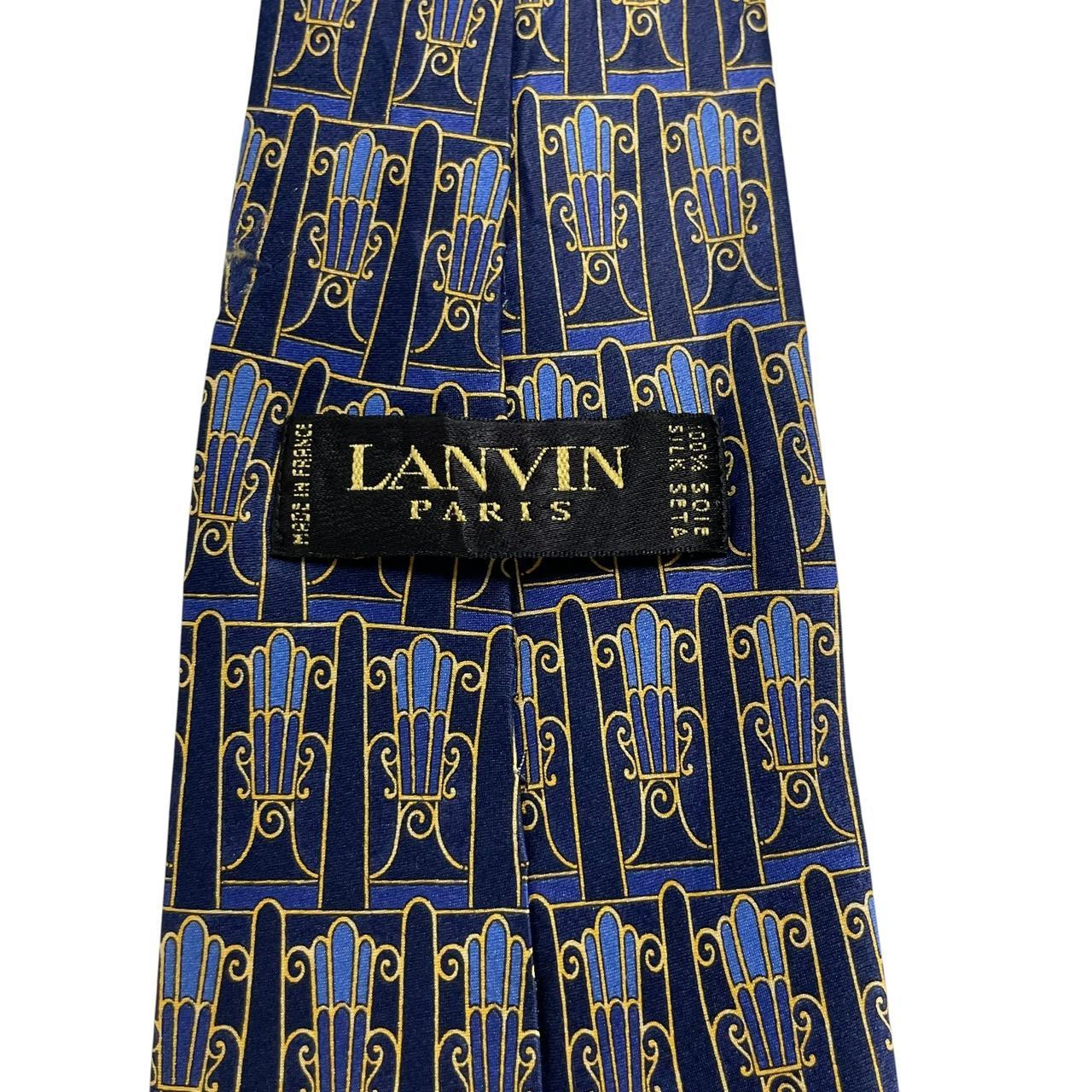 Lanvin silk tie featuring floral geometric print in vibrant colors.