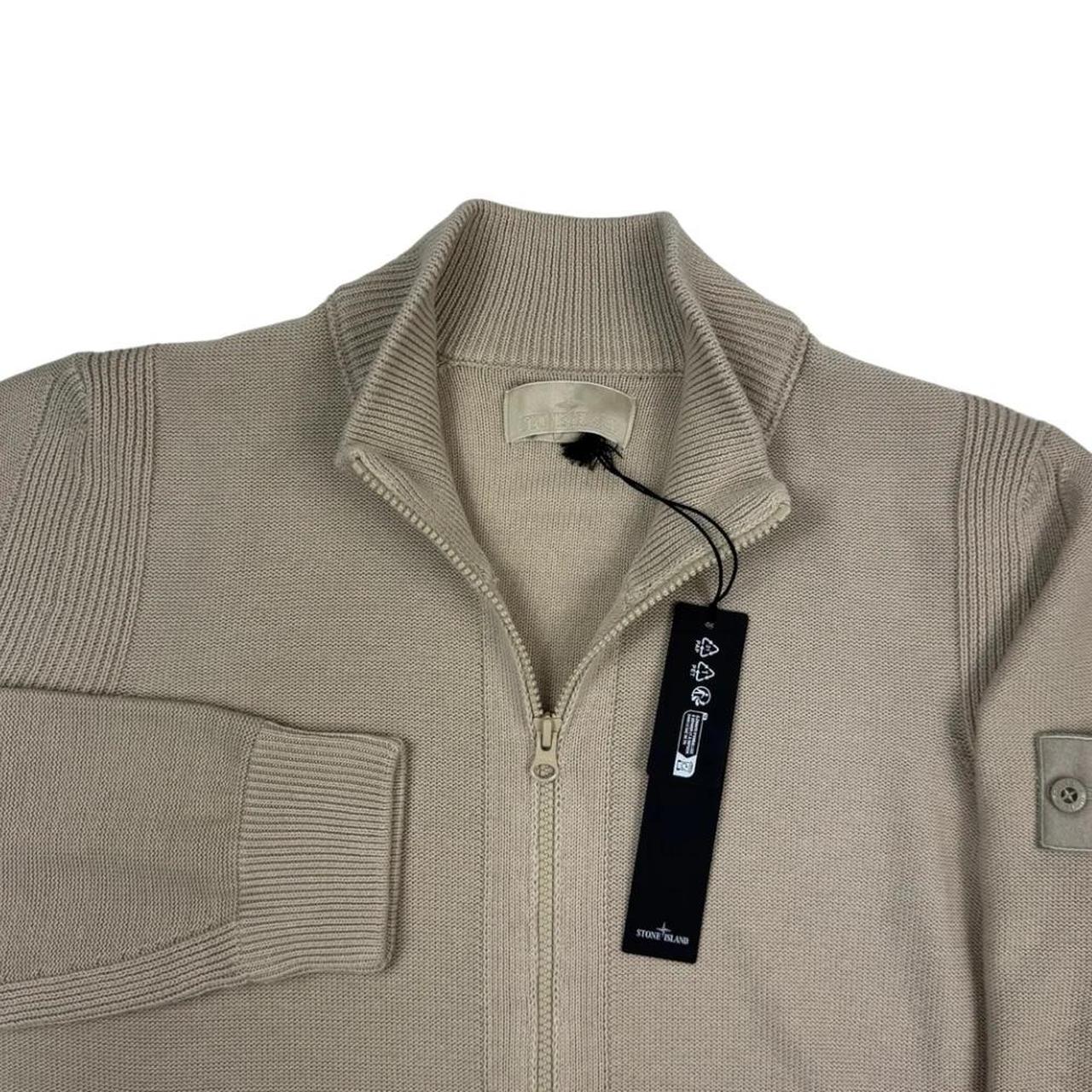 Stone Island beige knit jumper with stand collar, ribbed trims, and monochromatic badge.