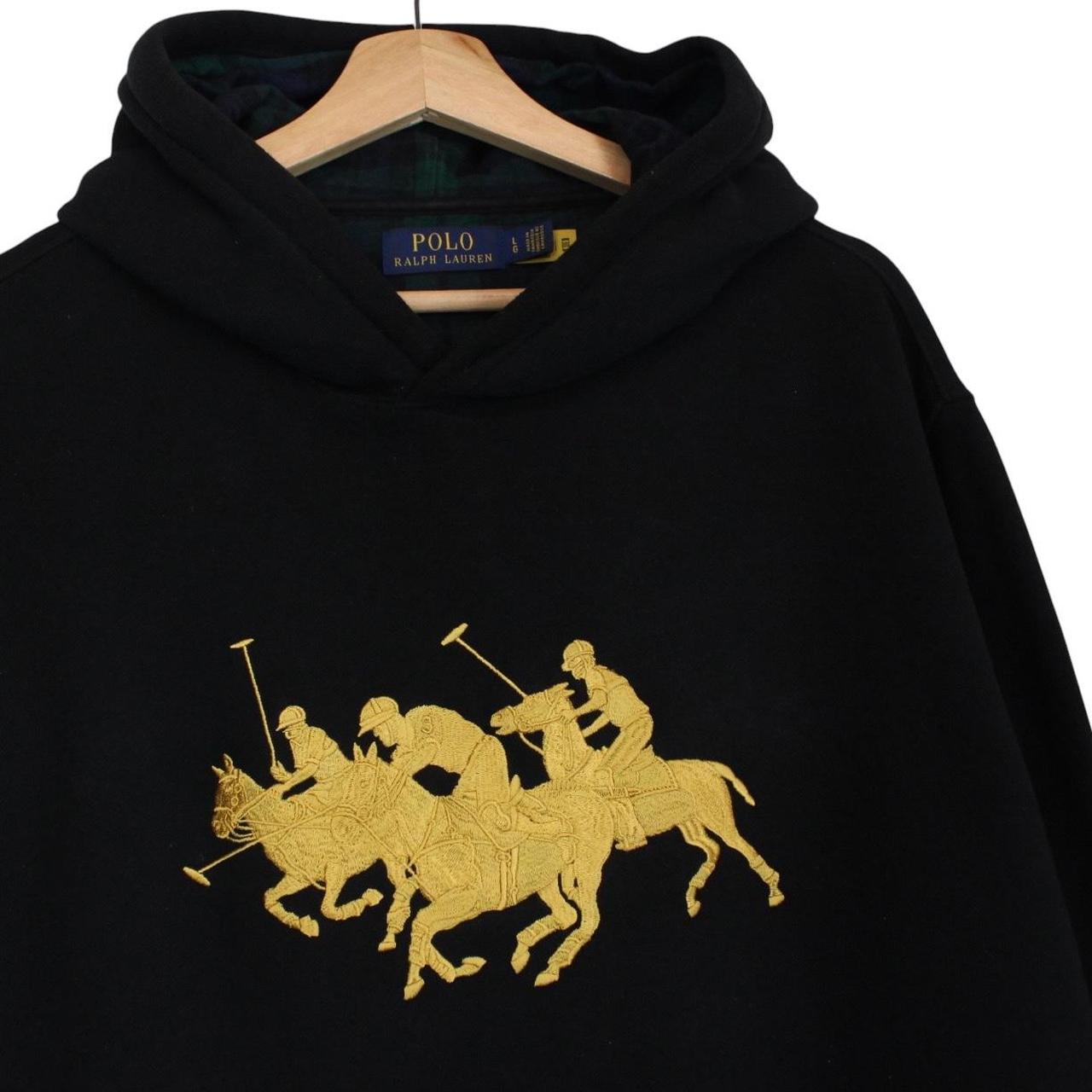 Polo Ralph Lauren black hoodie with gold embroidered Polo Match logo and drawstring.