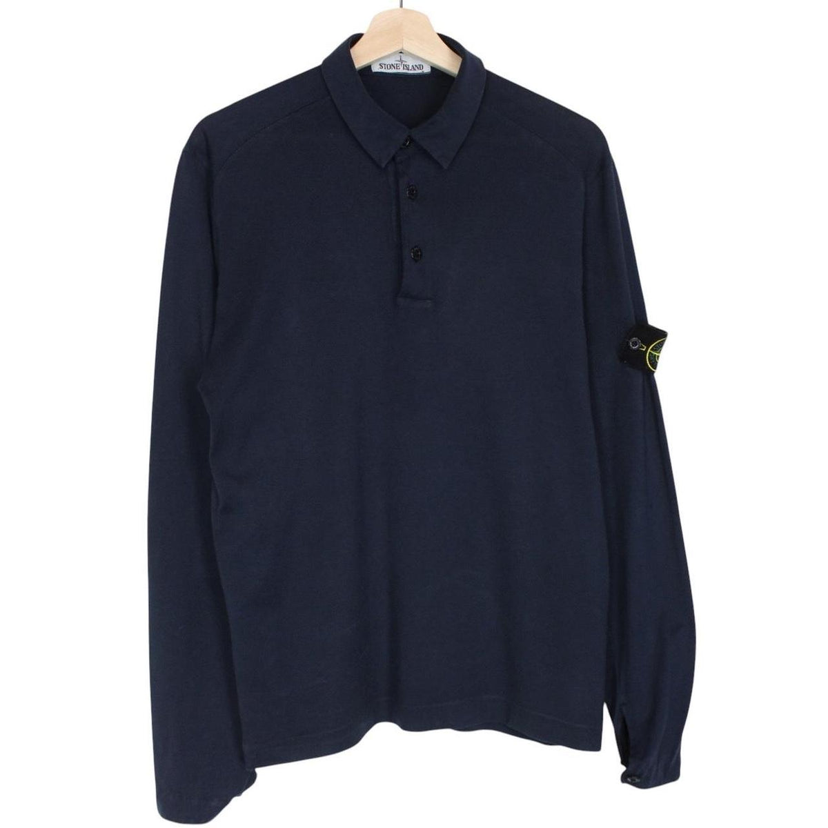 Stone Island navy blue long sleeve polo shirt with iconic compass logo on chest.