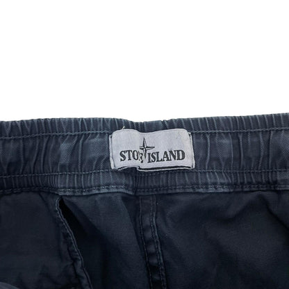 Stone Island navy blue cargo trousers with logo patch and RE-T fit design.