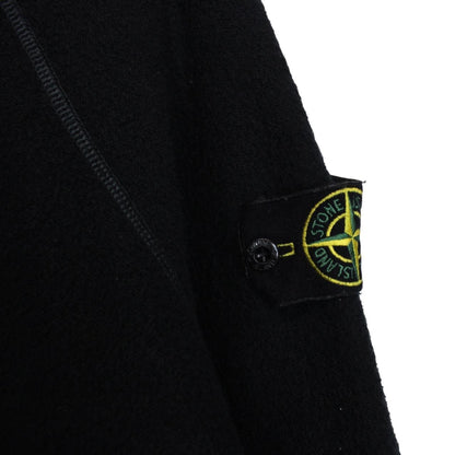 Stone Island black knit jumper with logo badge and cotton/nylon blend material.