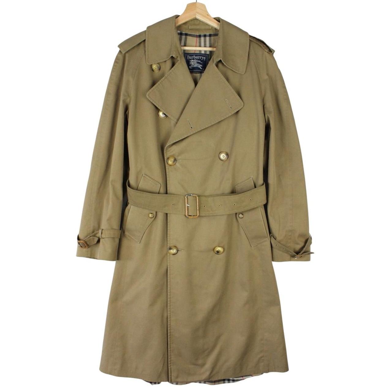 Burberry brown double breasted belted trench coat with classic check lining and logo details.
