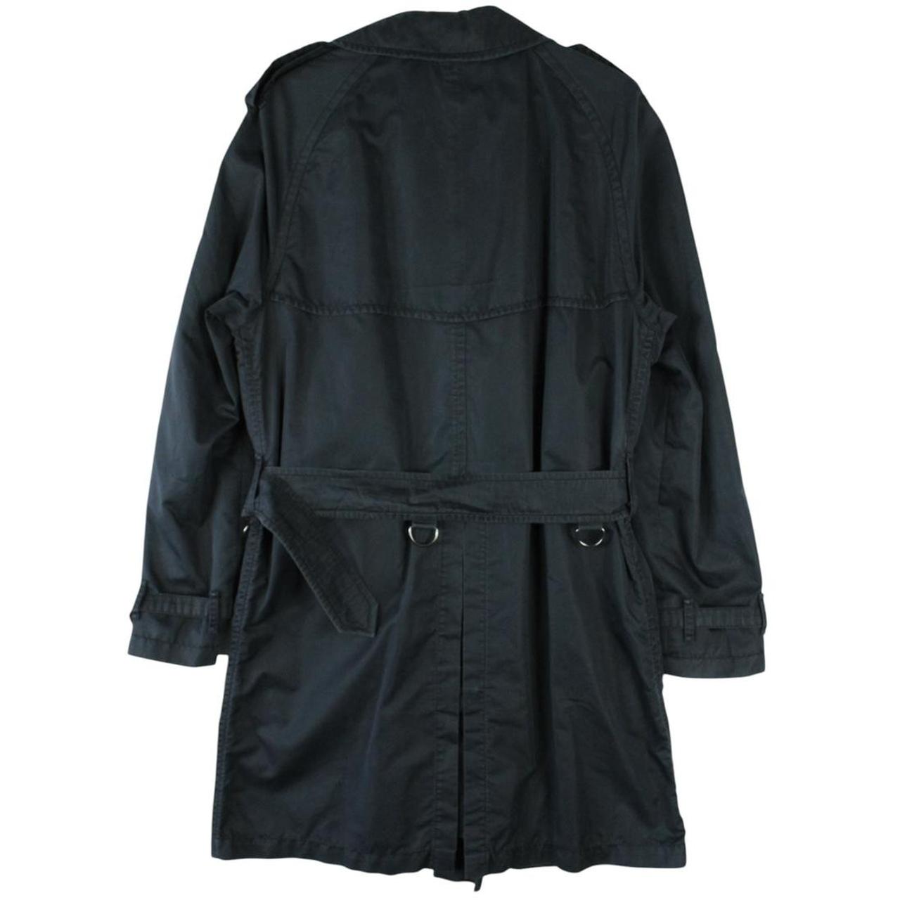 Burberry beige double breasted belted trench coat with classic check lining and logo detail.
