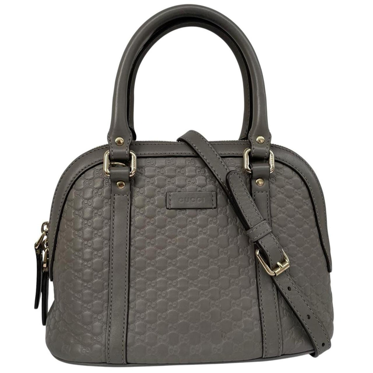 Gucci grey microguccissima mini dome shoulder bag with embossed logo and leather material.