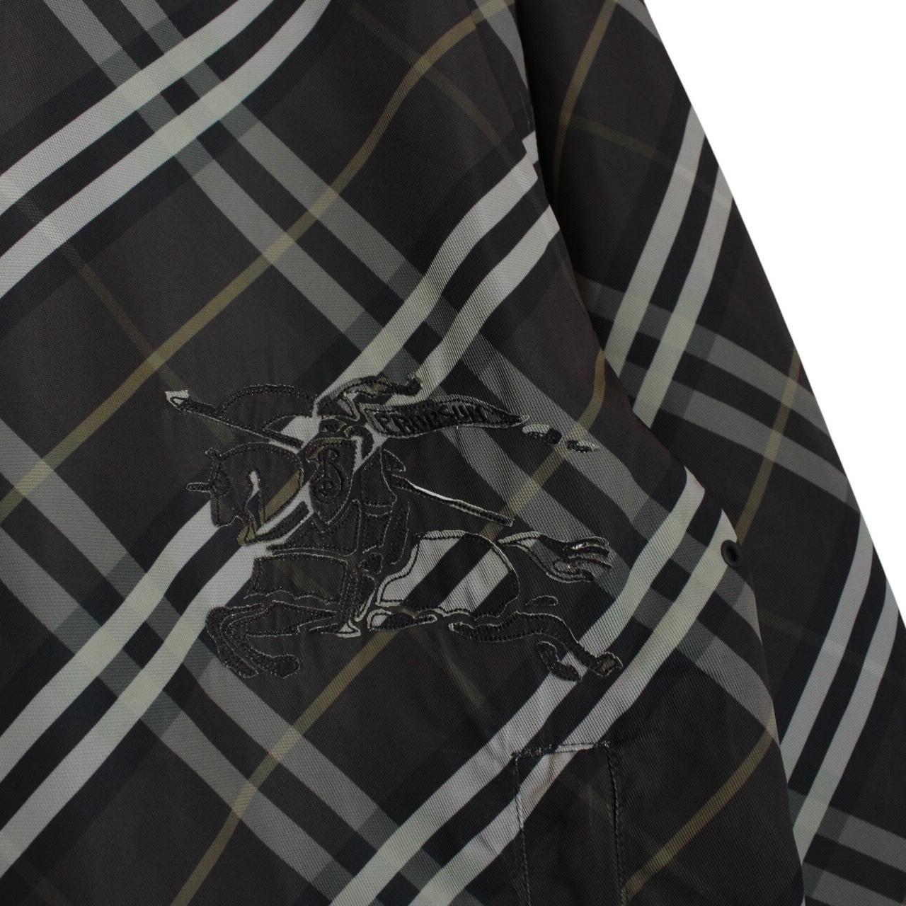 Burberry reversible jacket in dark grey and black with Nova Check pattern and full zip.