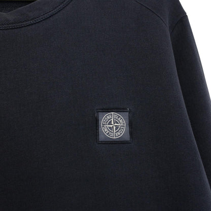 Stone Island navy blue cotton sweatshirt with logo patch and small sleeve repair.