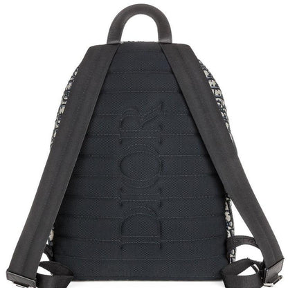 Dior beige and black oblique jacquard monogram rider backpack with logo pattern.
