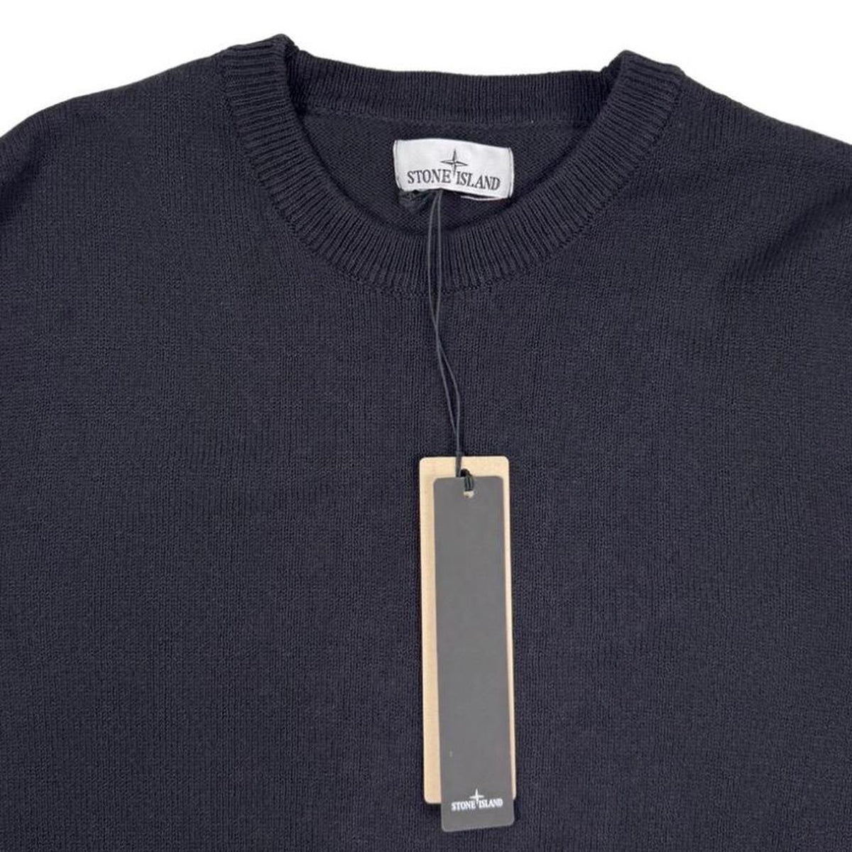 Stone Island black knit jumper with logo patch and organic cotton material.