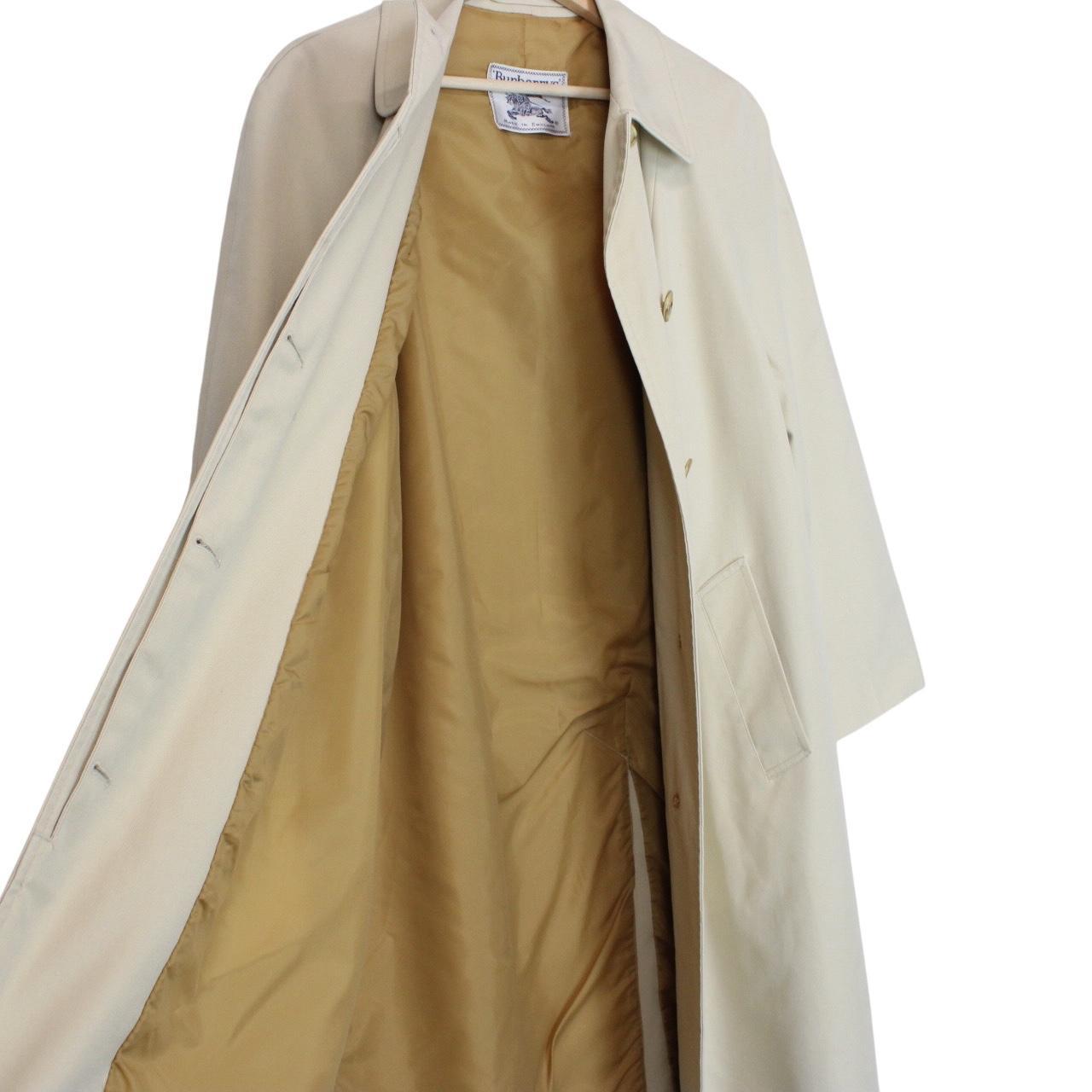 Burberry cream trench coat, single breasted, vintage 80s style, visible mark on sleeve.