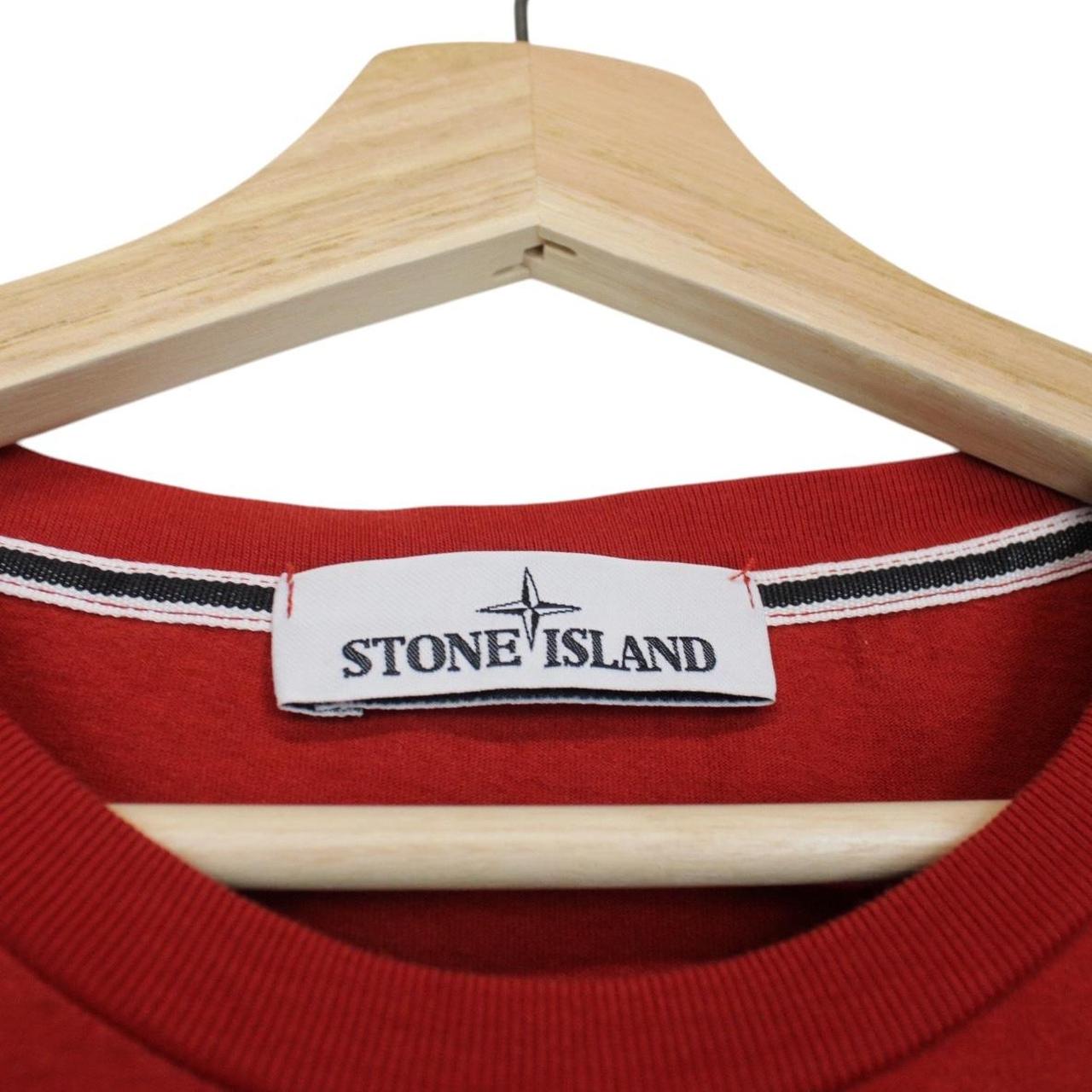 Stone Island red short sleeve t-shirt with reflective logo print and cotton material.