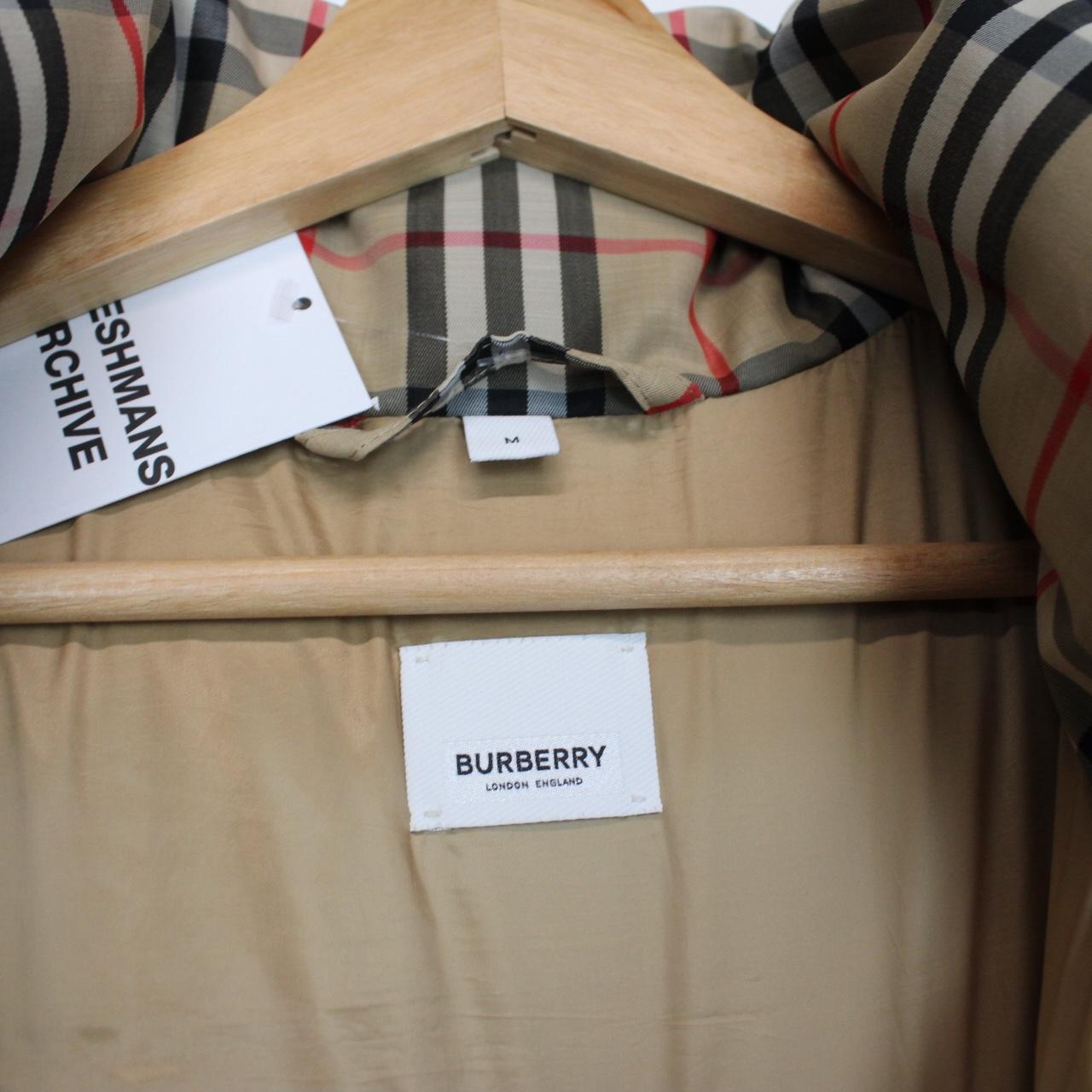 Burberry tan brown down gilet with Nova Check pattern and logo detail.