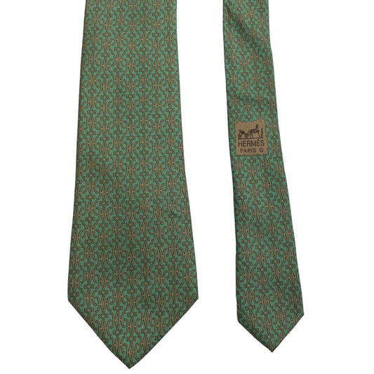 Hermes green silk tie with subtle sheen and logo detailing.
