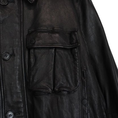 CP Company black leather jacket with multi pockets and logo detail.