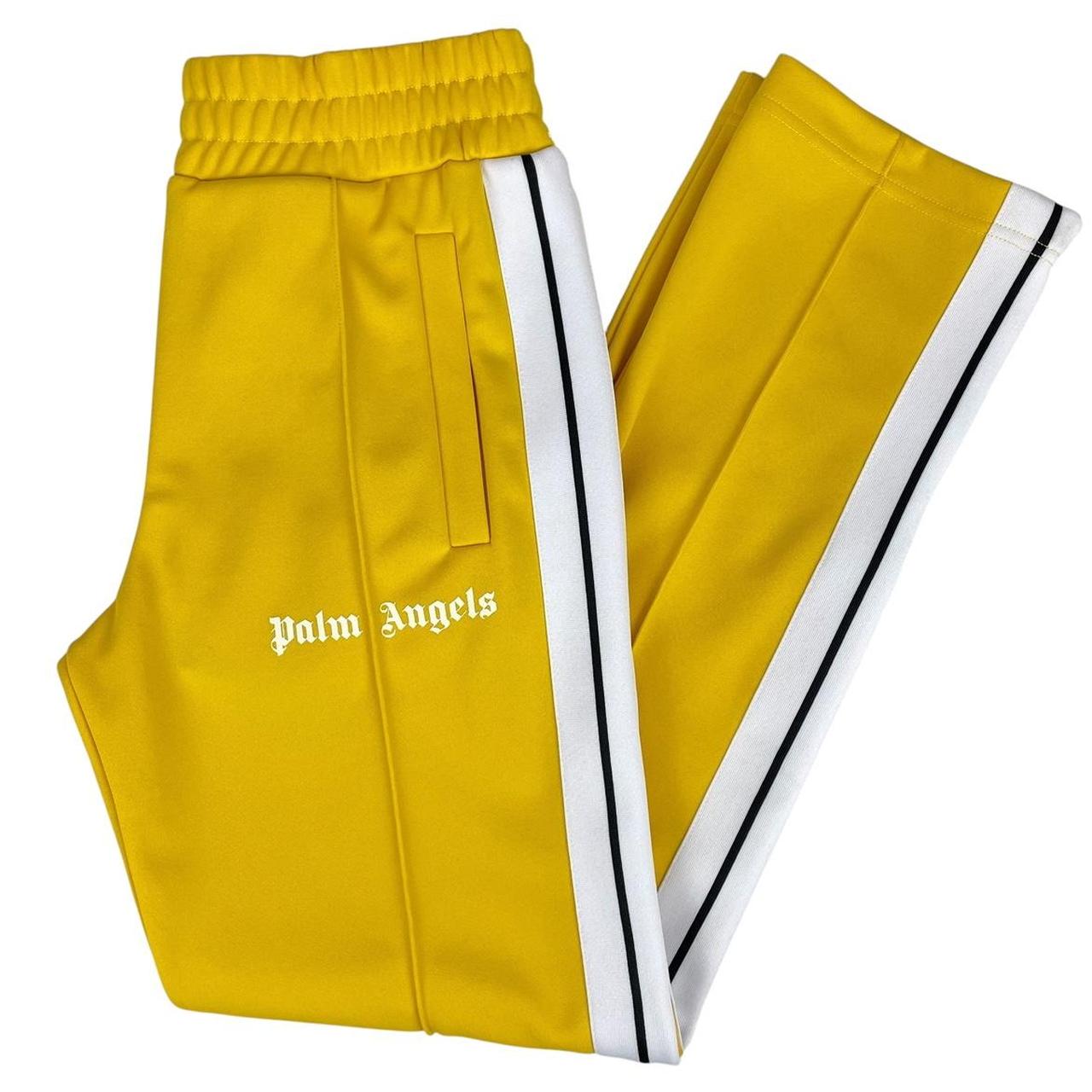 Palm Angels white and yellow joggers with logo detailing and classic fit.