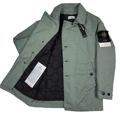 Stone Island green jacket with Primaloft insulation and iconic compass logo.