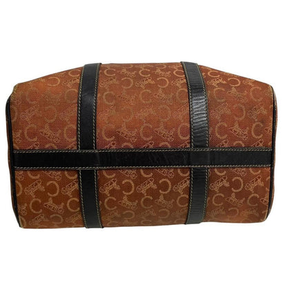 CELINE orange duffel bag with Macadam canvas and leather, visible wear and discolouration.