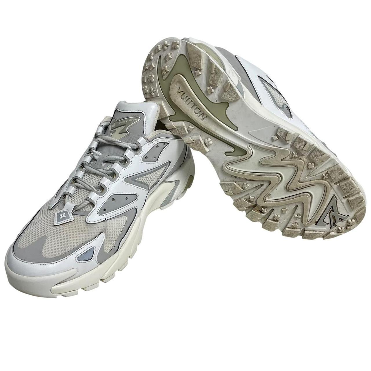 Louis Vuitton white trainers with logo detailing and sleek design, pre-owned condition.